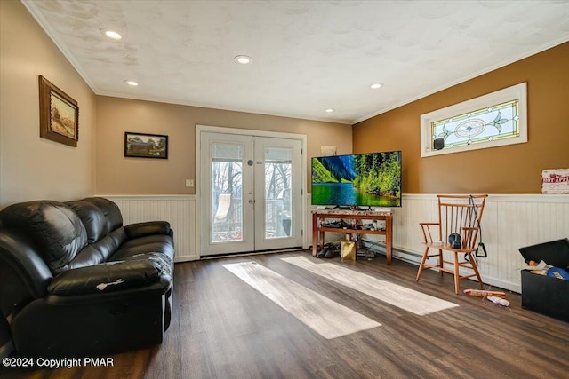 living area featuring wainscoting, crown molding, wood finished floors, and french doors