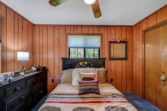 123 Lake Dr E, Clifton Township, PA 18424 - carpeted bedroom with a textured ceiling and wooden walls