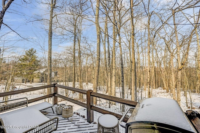 view of snow covered deck