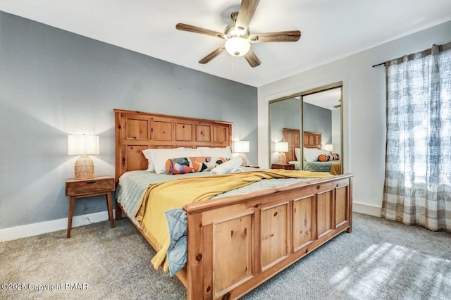 carpeted bedroom featuring ceiling fan and a closet