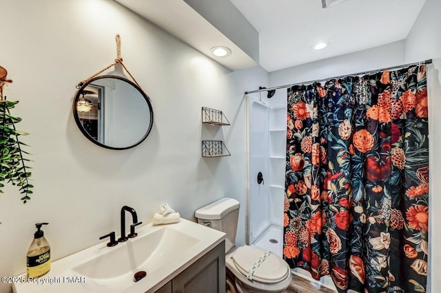 bathroom with vanity, toilet, and a shower with shower curtain