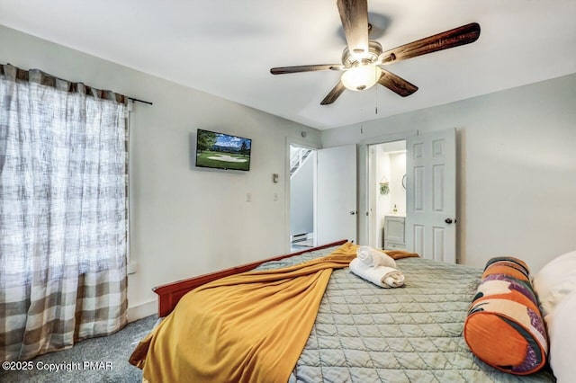 bedroom featuring ensuite bathroom, ceiling fan, and carpet flooring