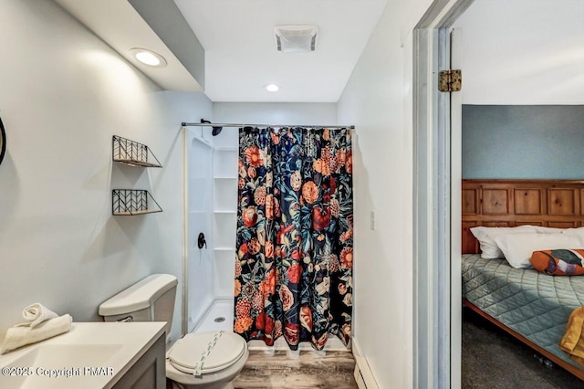 bathroom with vanity, wood-type flooring, toilet, and a shower with curtain