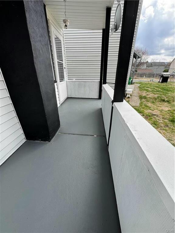 view of patio featuring a balcony