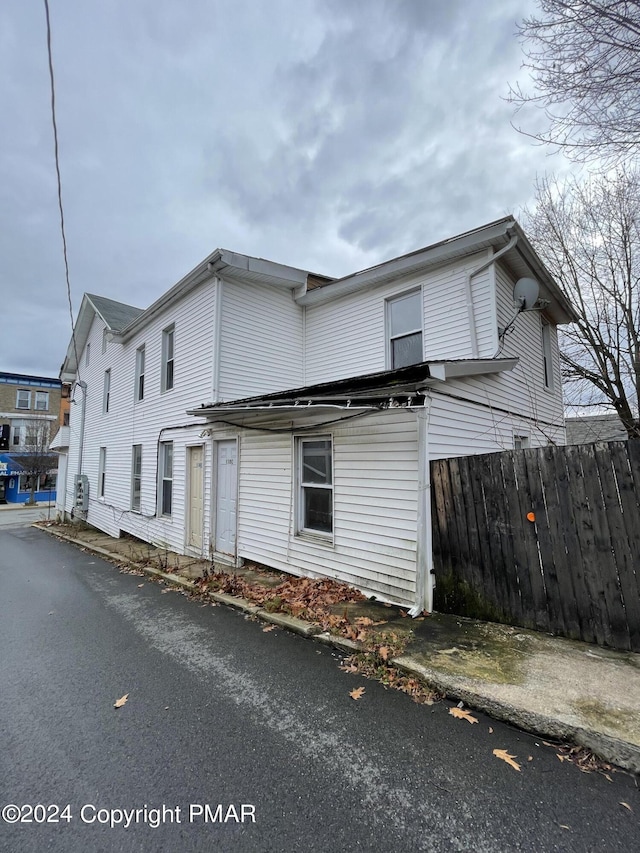 view of side of property with fence