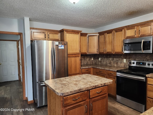 kitchen with dark wood finished floors, brown cabinets, stainless steel appliances, and backsplash