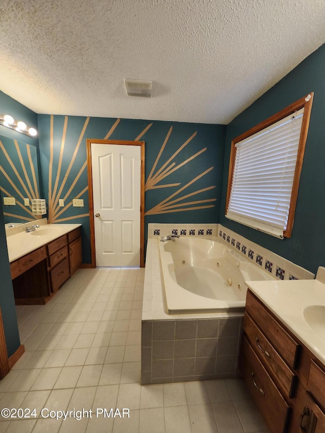 bathroom with tile patterned floors, a textured ceiling, two vanities, and wallpapered walls