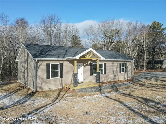 ranch-style home featuring roof with shingles and crawl space