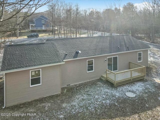 back of property featuring a shingled roof, crawl space, and a wooden deck