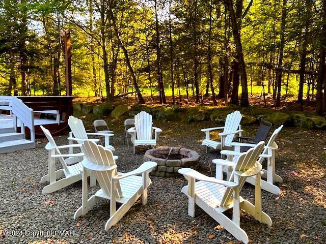 view of patio / terrace with a fire pit