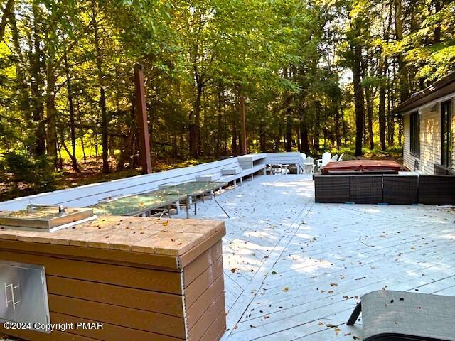 wooden terrace featuring an outdoor living space