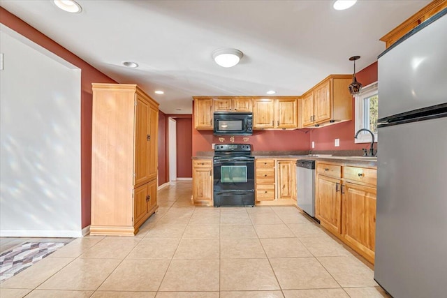 kitchen with light tile patterned floors, baseboards, black appliances, and recessed lighting