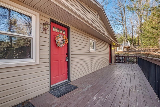 doorway to property with a wooden deck