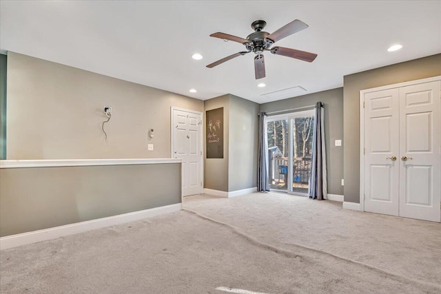 empty room featuring carpet flooring, recessed lighting, baseboards, and ceiling fan