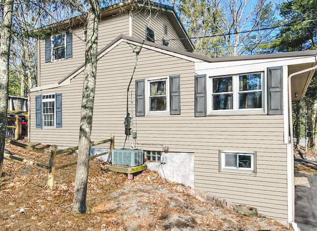 view of side of property with central AC