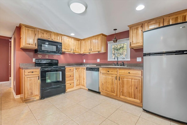 kitchen featuring a sink, black appliances, recessed lighting, and light tile patterned floors