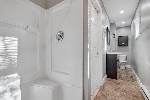 full bath with vanity, baseboards, recessed lighting, toilet, and baseboard heating