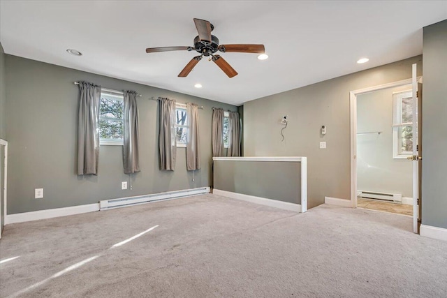 empty room featuring recessed lighting, a baseboard radiator, baseboards, and carpet floors