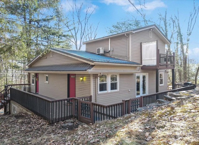 view of front of property with a wooden deck and metal roof