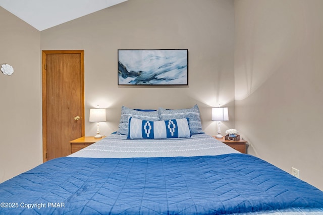 bedroom with lofted ceiling