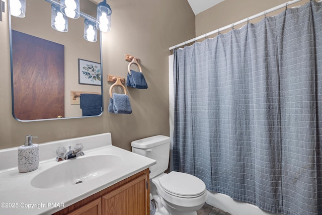 bathroom featuring toilet and vanity