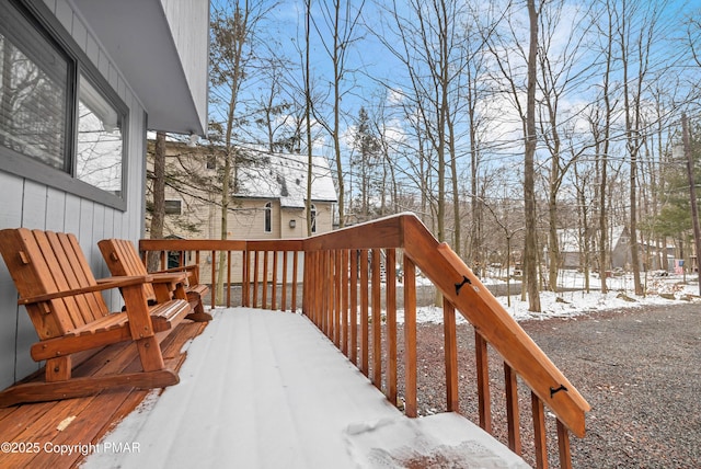 view of snow covered deck