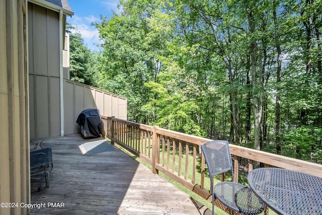 wooden deck featuring grilling area