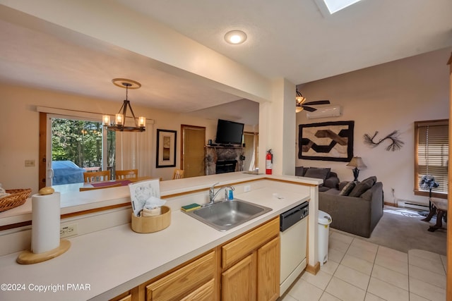 kitchen featuring a wall unit AC, white dishwasher, a sink, light countertops, and open floor plan