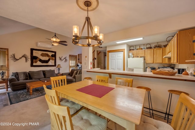 dining space with lofted ceiling, a wall unit AC, ceiling fan with notable chandelier, and carpet floors