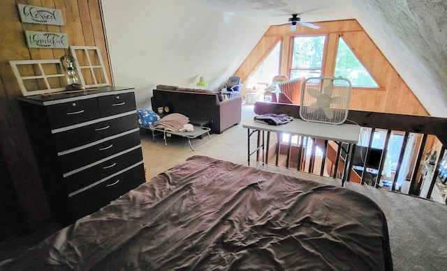 195 Bellingham Dr, Bushkill, PA 18324 - carpeted bedroom featuring lofted ceiling and wooden walls