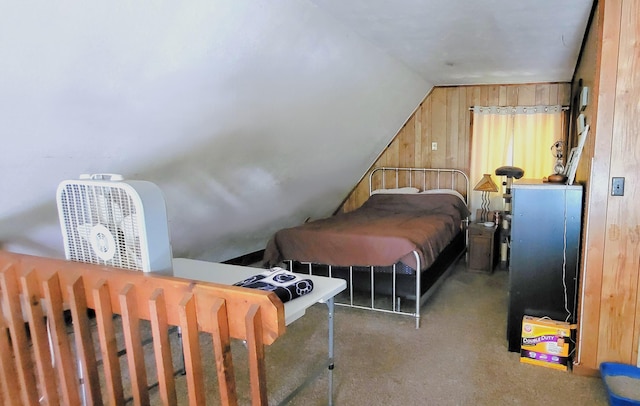 195 Bellingham Dr, Bushkill, PA 18324 - bedroom with wooden walls, vaulted ceiling, and carpet flooring