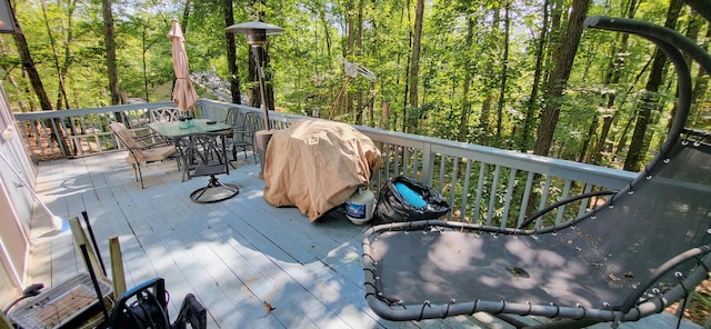 195 Bellingham Dr, Bushkill, PA 18324 - deck with outdoor dining space and a wooded view