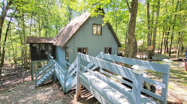195 Bellingham Dr, Bushkill, PA 18324 - rear view of property with a sunroom and a shingled roof