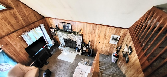 195 Bellingham Dr, Bushkill, PA 18324 - carpeted living area with wooden walls and a brick fireplace