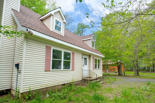 9860 Deerwood Dr, Tobyhanna, PA 18466 - view of front facade with a shingled roof and a chimney
