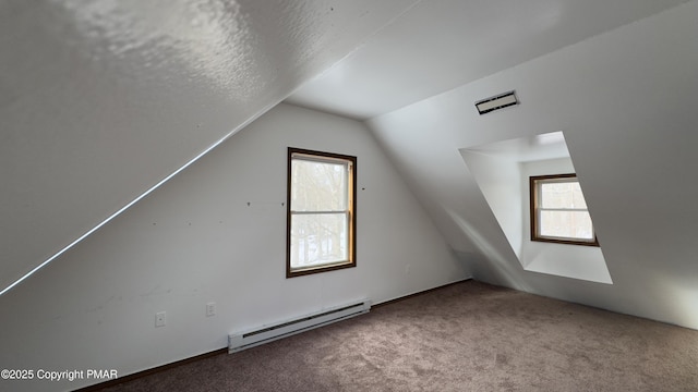 9860 Deerwood Dr, Tobyhanna, PA 18466 - additional living space featuring a baseboard radiator, lofted ceiling, carpet floors, and a textured ceiling