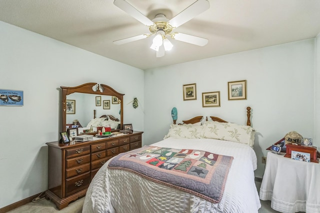 bedroom featuring a ceiling fan and light carpet