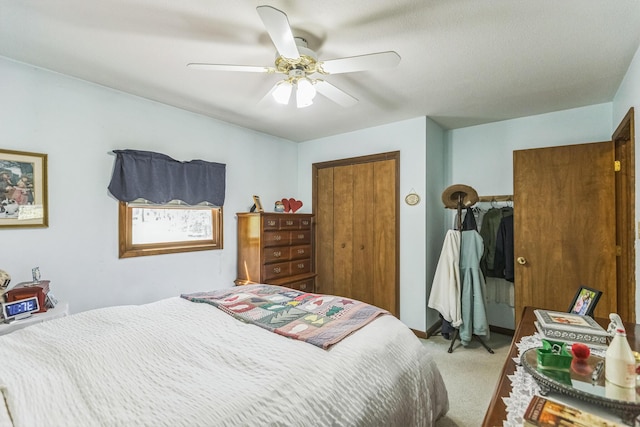 bedroom featuring ceiling fan, carpet, and a closet