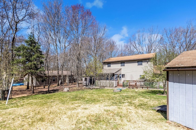 view of yard featuring an outbuilding and a deck