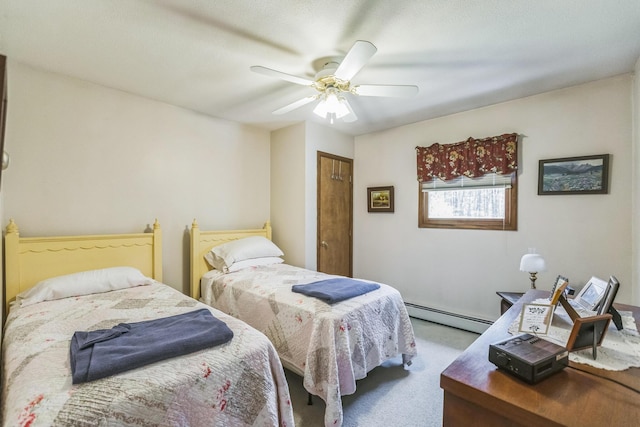 bedroom featuring ceiling fan, carpet, and a baseboard radiator