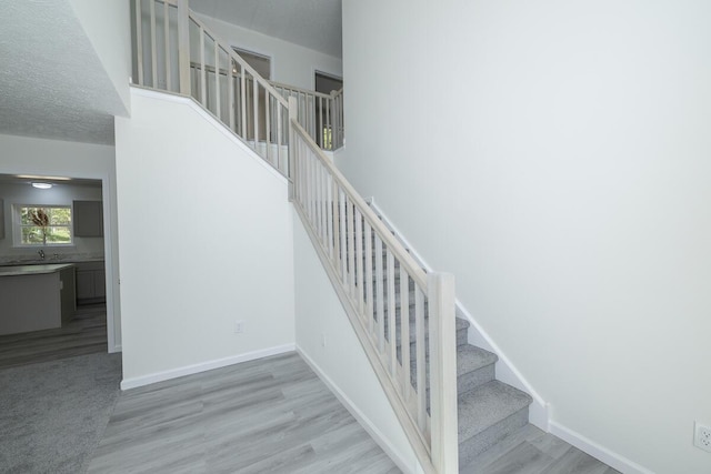 9133 Belvedere Rd # 5020, Tobyhanna, PA 18466 - stairs featuring wood finished floors and baseboards