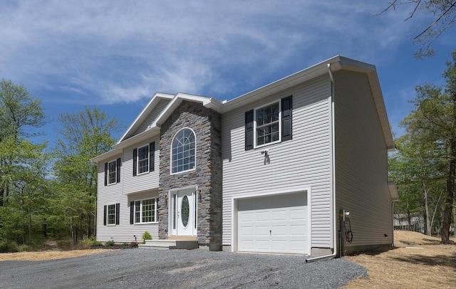 9133 Belvedere Rd # 5020, Tobyhanna, PA 18466 - view of front of home with stone siding, driveway, and a garage
