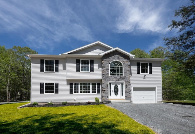 9133 Belvedere Rd # 5020, Tobyhanna, PA 18466 - traditional-style house with a garage, driveway, a front yard, and stone siding