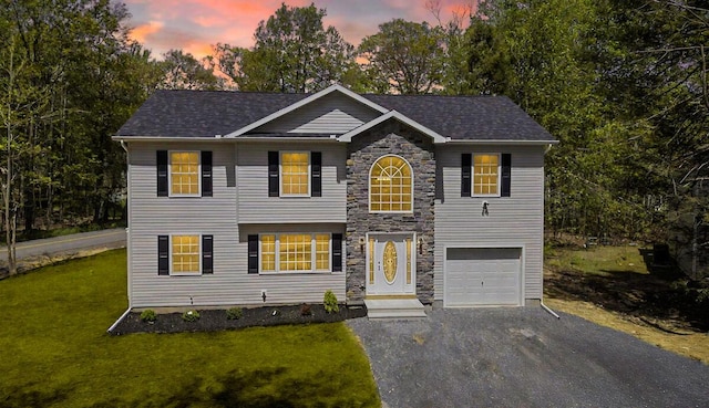 9133 Belvedere Rd # 5020, Tobyhanna, PA 18466 - view of front of home featuring asphalt driveway, a yard, a garage, and stone siding