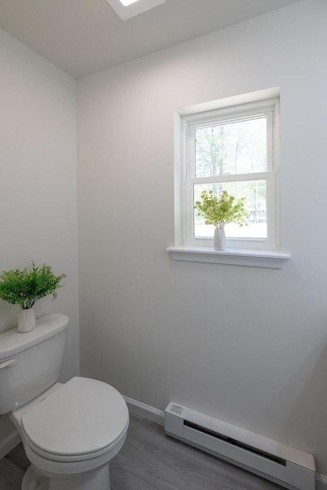 9133 Belvedere Rd # 5020, Tobyhanna, PA 18466 - bathroom featuring a baseboard radiator, toilet, baseboards, and wood finished floors