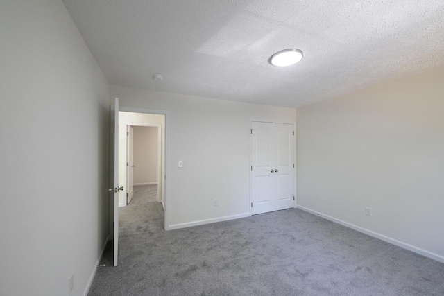 9133 Belvedere Rd # 5020, Tobyhanna, PA 18466 - carpeted spare room with baseboards and a textured ceiling
