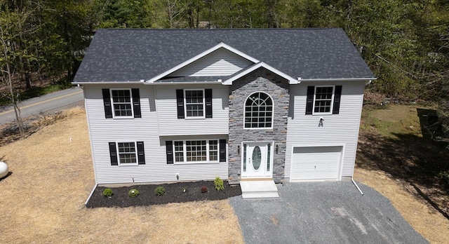 9133 Belvedere Rd # 5020, Tobyhanna, PA 18466 - traditional-style house featuring stone siding, driveway, an attached garage, and a shingled roof