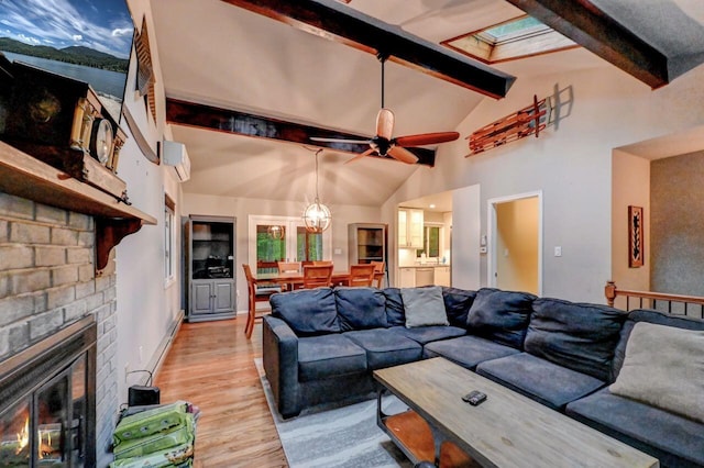 3207 Green Meadow Cir, Pocono Pines, PA 18350 - living area with light wood-type flooring, ceiling fan, a wall mounted air conditioner, and a fireplace