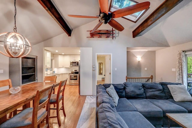 3207 Green Meadow Cir, Pocono Pines, PA 18350 - living area with a chandelier, light wood finished floors, beamed ceiling, ceiling fan, and high vaulted ceiling