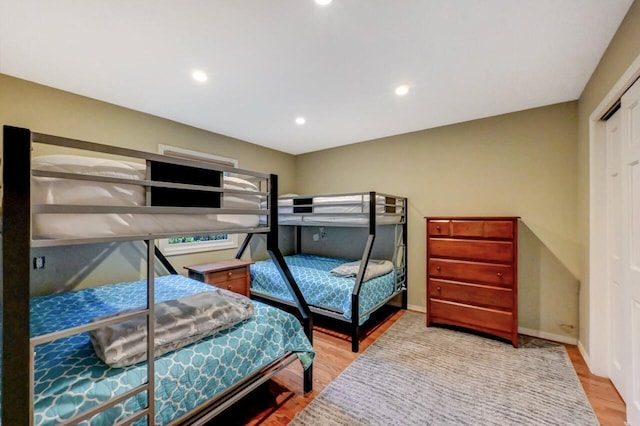 3207 Green Meadow Cir, Pocono Pines, PA 18350 - bedroom with wood finished floors, baseboards, recessed lighting, and a closet